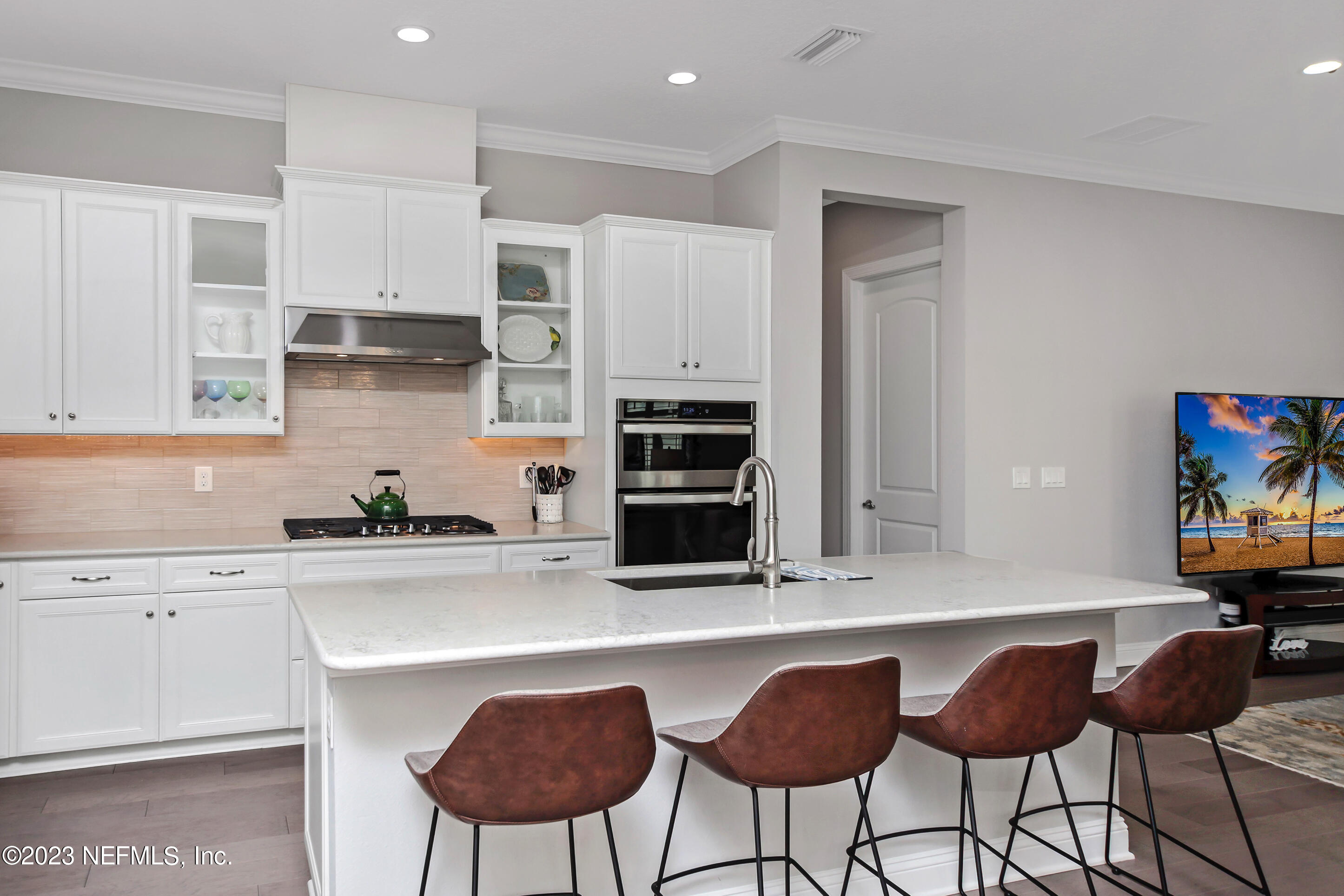 67 Carousel Drive Ponte Vedra, FL 32081 - Photo 4 of 30 a kitchen with stainless steel appliances a dining table chairs and granite counter tops