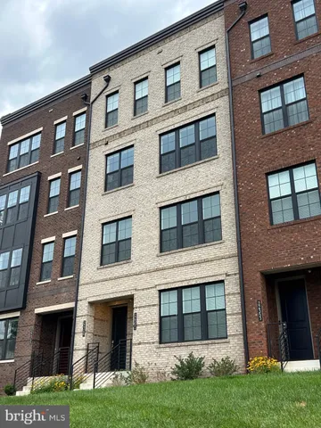 a large building with a yard in front of it