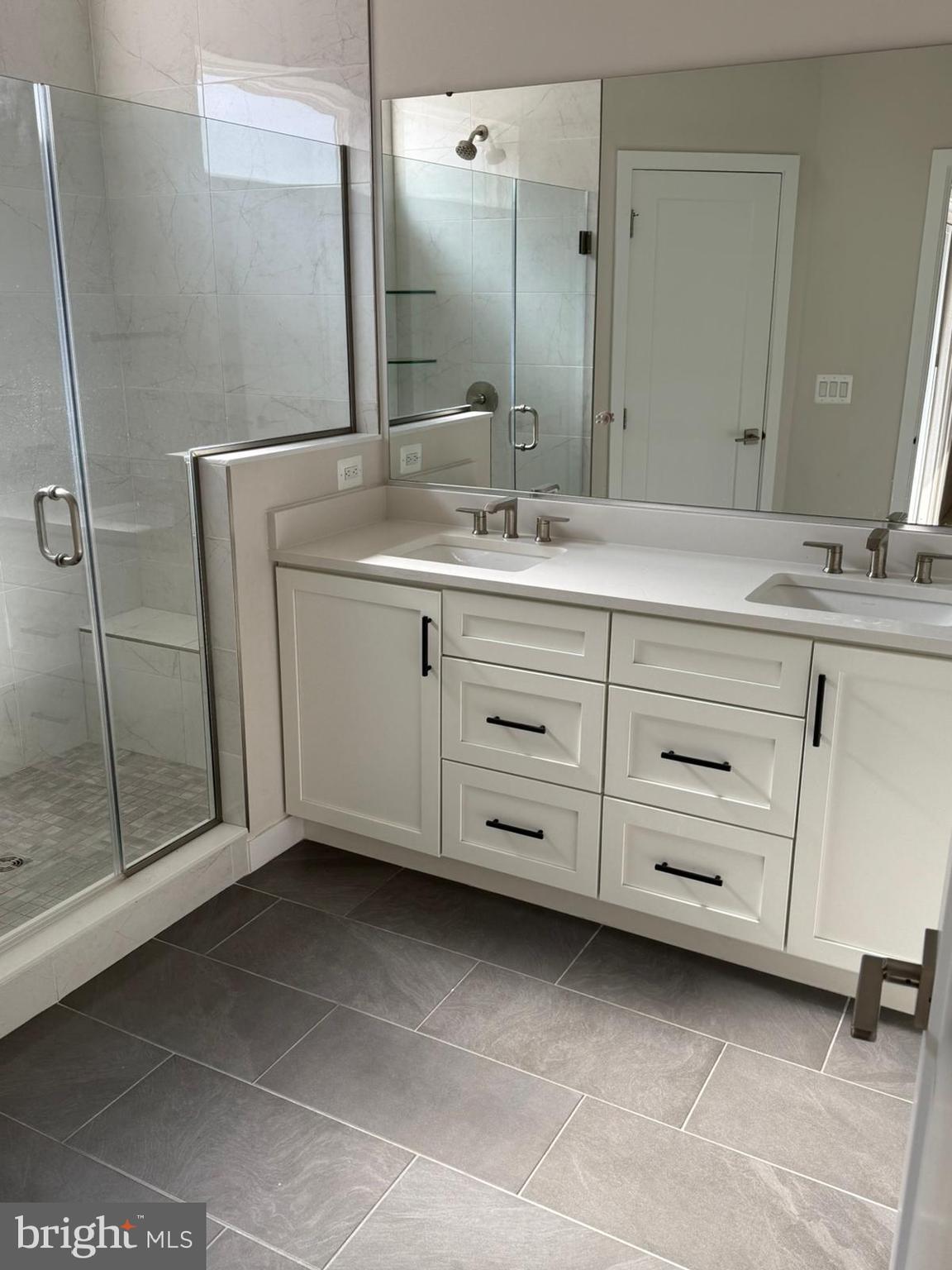22351 Roanoke Rise Terrace Ashburn, VA 20148 - Photo 12 of 28 a bathroom with a double vanity sink mirror and double