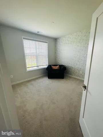 an empty room with a bench