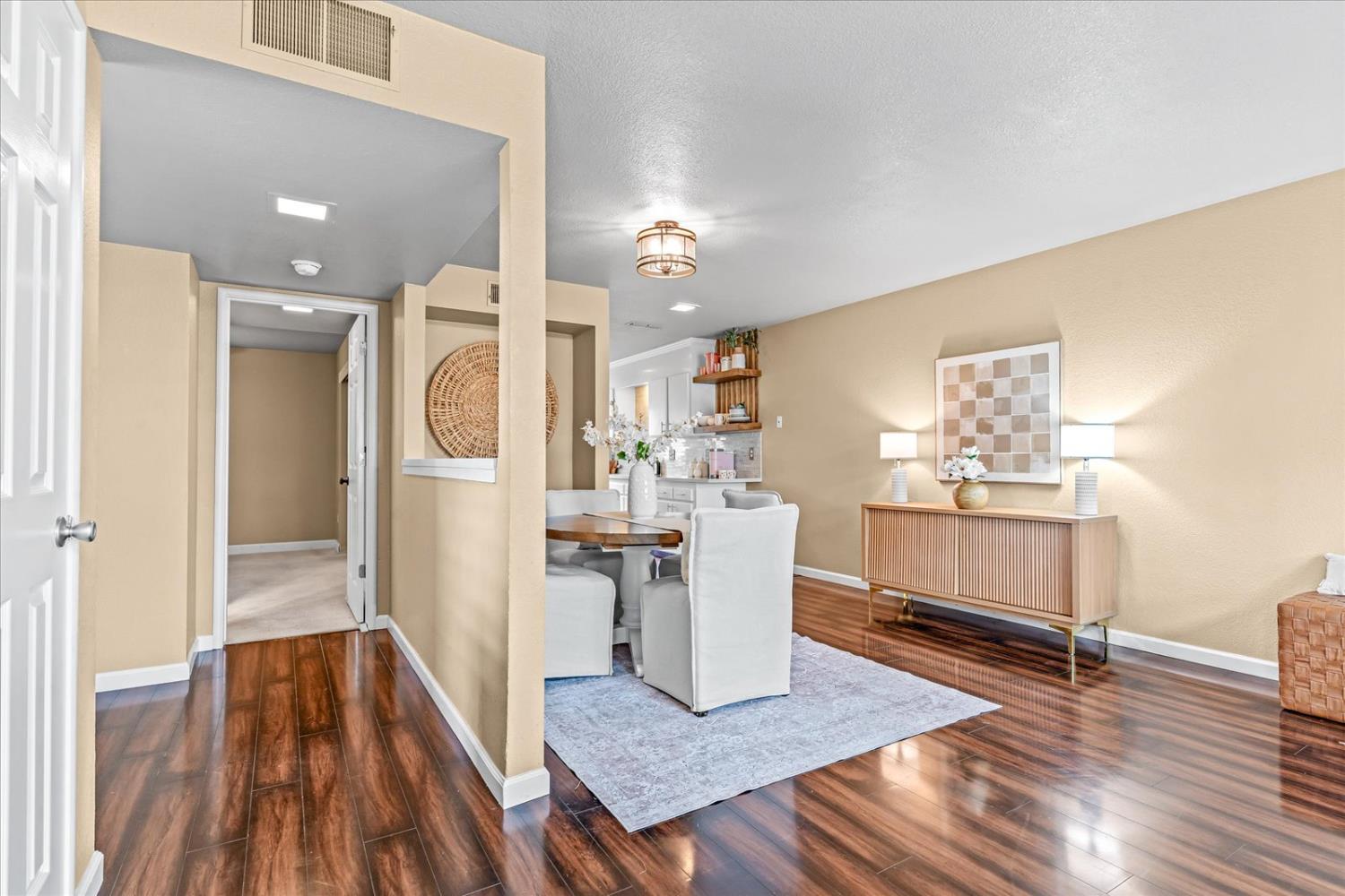 750 Lincoln Road, Unit 58 Yuba City, CA 95991 - Photo 11 of 69 a view of kitchen and hall with wooden floor