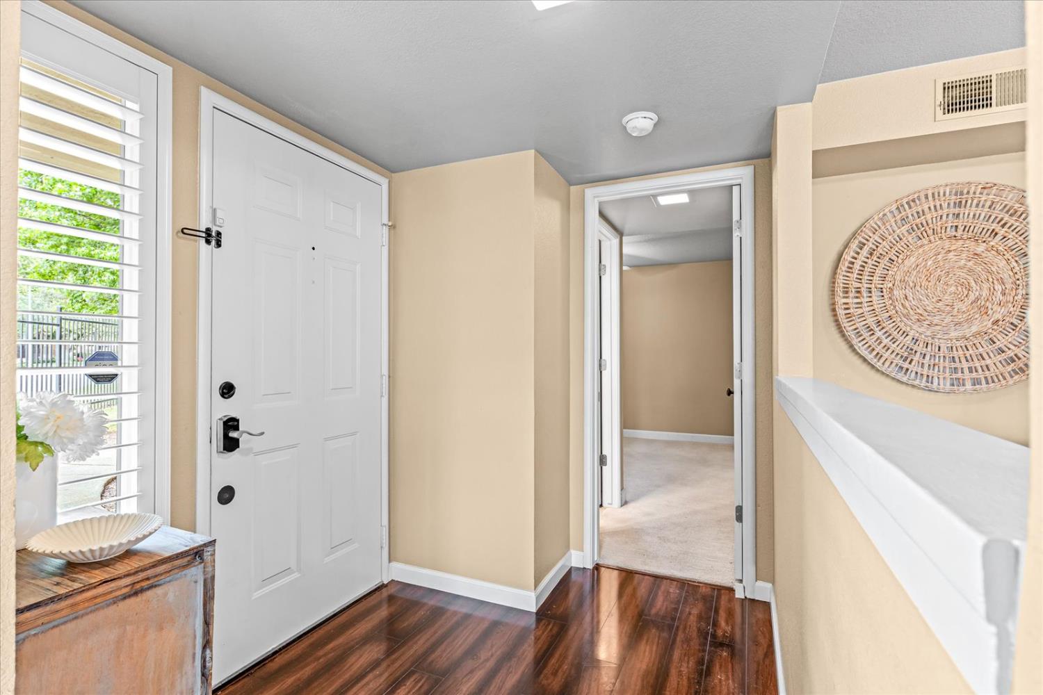750 Lincoln Road, Unit 58 Yuba City, CA 95991 - Photo 12 of 69 a view of a hallway with wooden floor and a bathroom