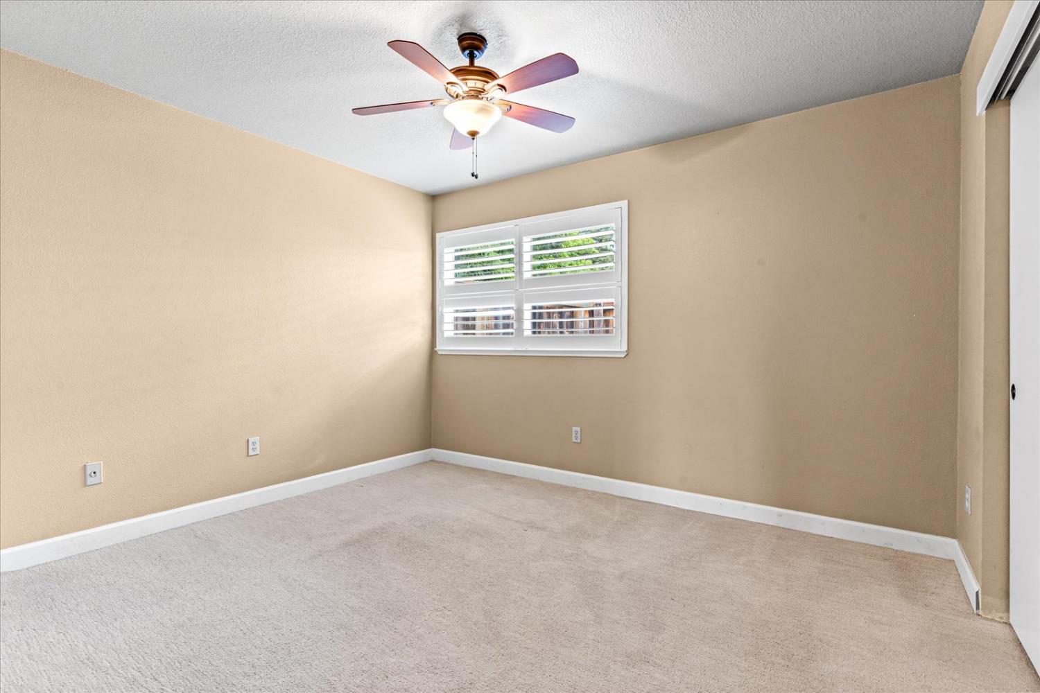 750 Lincoln Road, Unit 58 Yuba City, CA 95991 - Photo 14 of 69 an empty room with a window and a fan