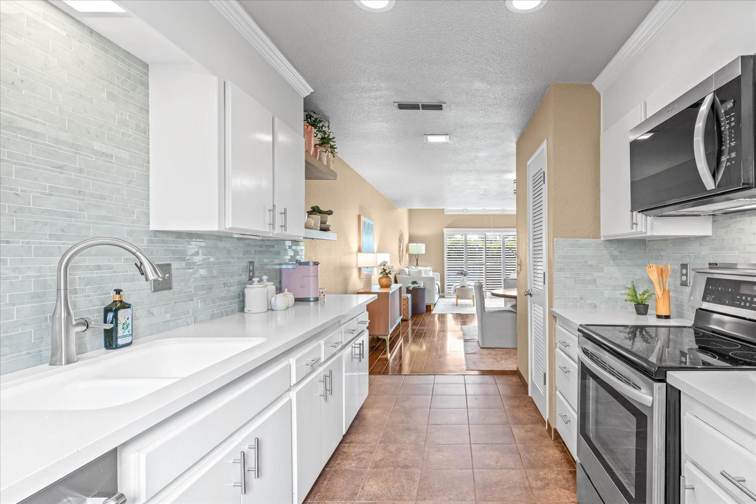 750 Lincoln Road, Unit 58 Yuba City, CA 95991 - Photo 31 of 69 a kitchen with lots of counter top space a sink cabinets and appliances