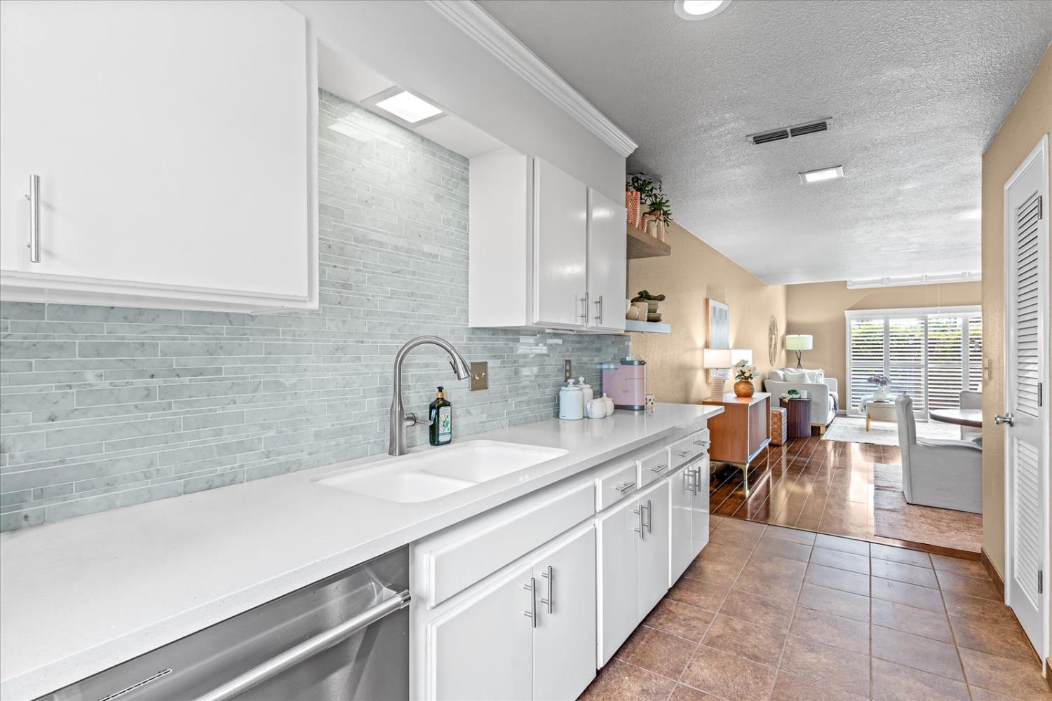 750 Lincoln Road, Unit 58 Yuba City, CA 95991 - Photo 32 of 69 a large white kitchen with lots of counter space and a sink