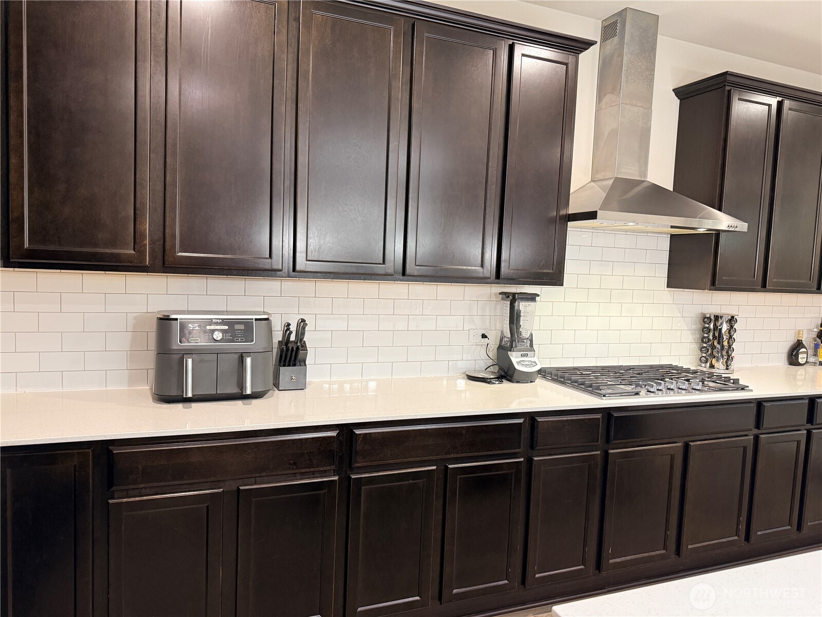 4880 Limerick Drive Southwest Port Orchard, WA 98367 - Photo 14 of 38 a kitchen with stainless steel appliances granite countertop a sink a refrigerator and cabinets