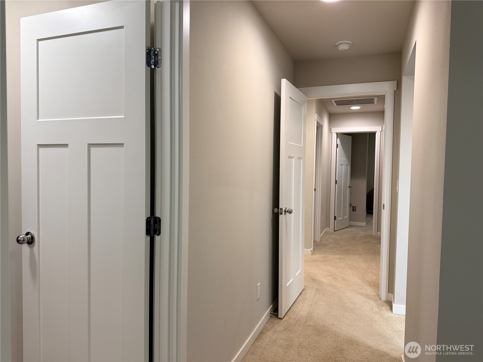 4880 Limerick Drive Southwest Port Orchard, WA 98367 - Photo 28 of 38 a view of a bathroom from a hallway to other door