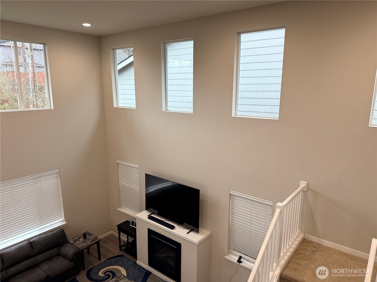 4880 Limerick Drive Southwest Port Orchard, WA 98367 - Photo 35 of 38 a view of workspace with windows cabinet and flat screen tv