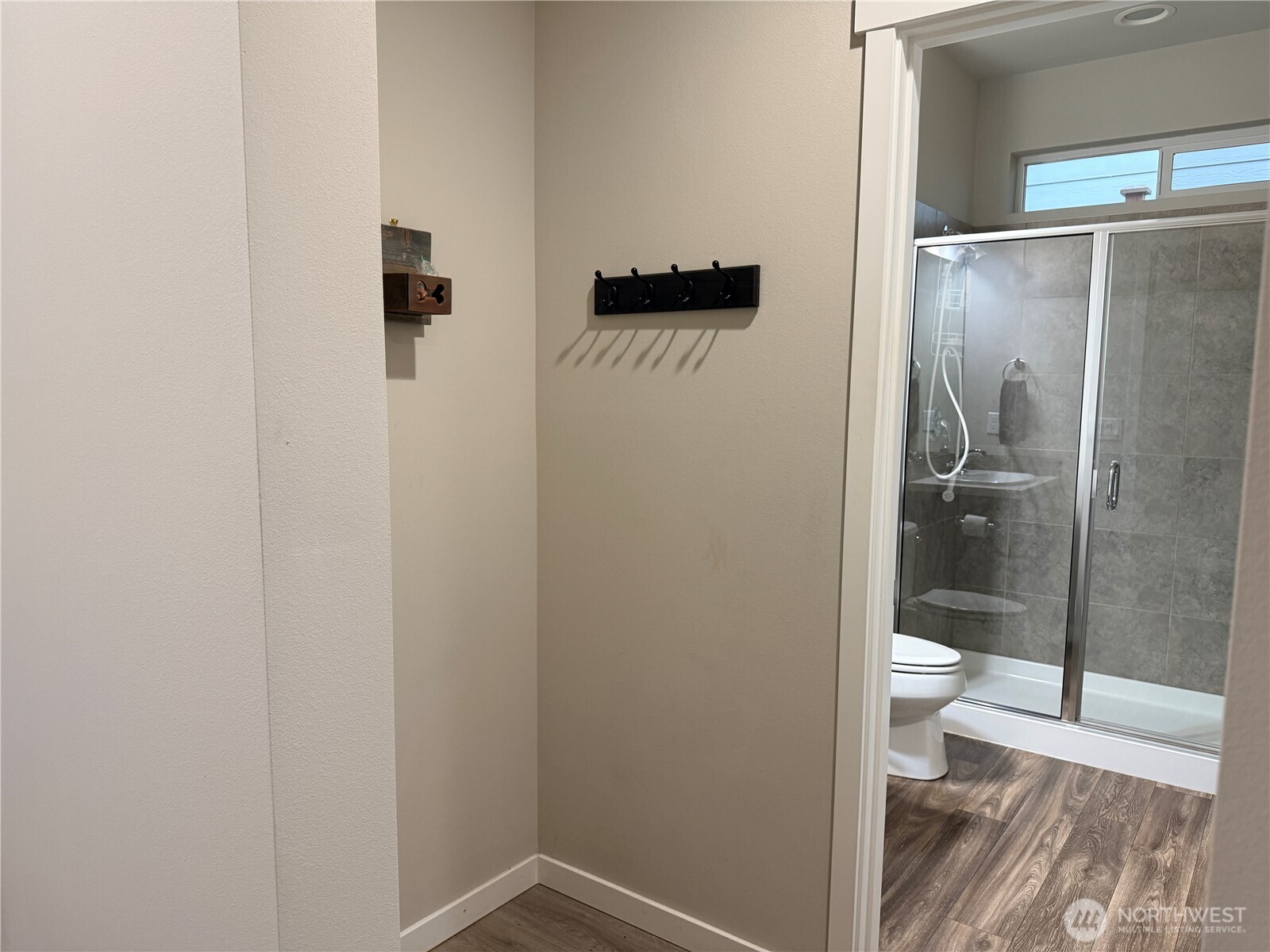 4880 Limerick Drive Southwest Port Orchard, WA 98367 - Photo 4 of 38 a bathroom with a granite countertop toilet and a shower