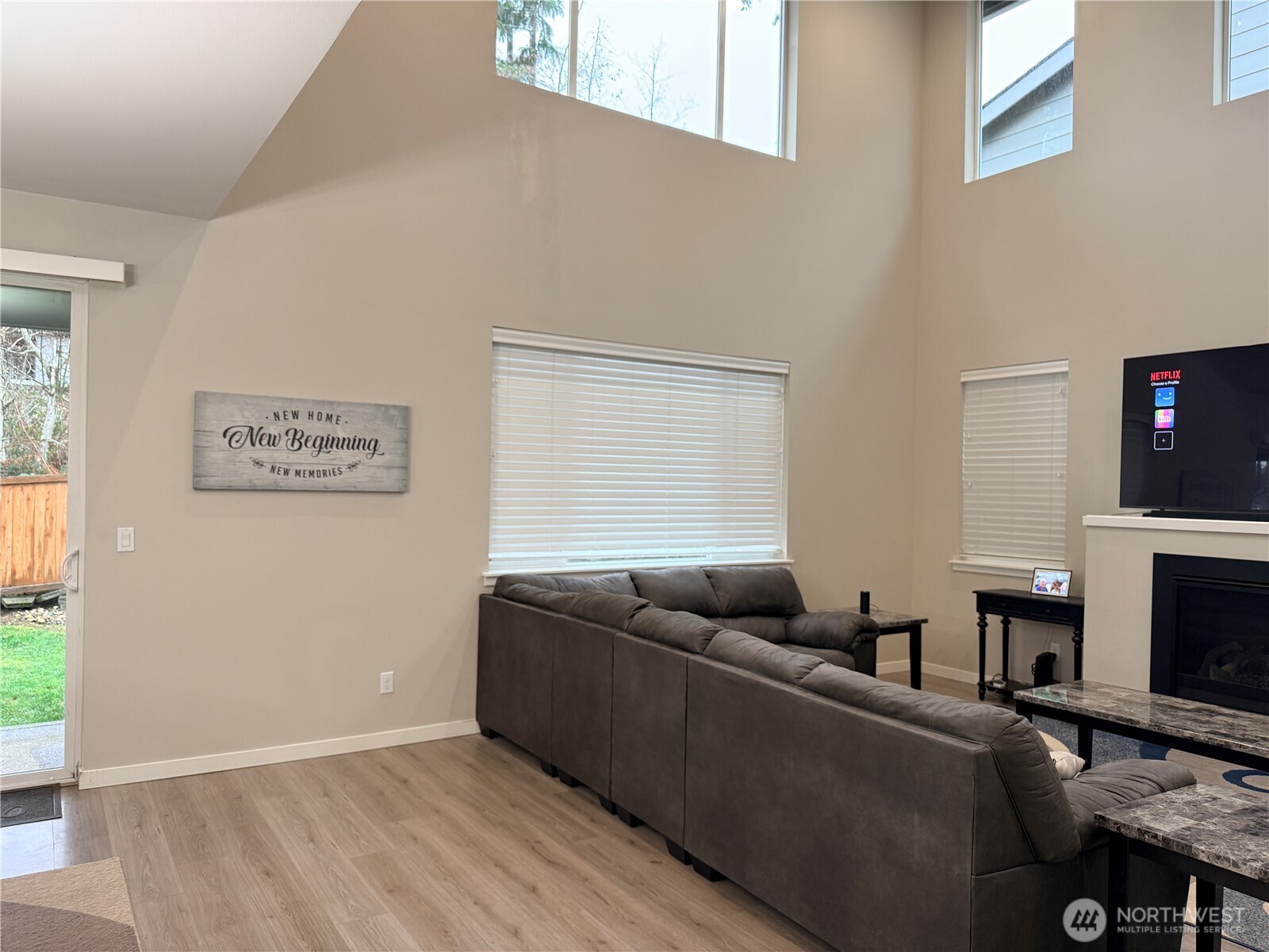 4880 Limerick Drive Southwest Port Orchard, WA 98367 - Photo 8 of 38 a living room with furniture and a fireplace