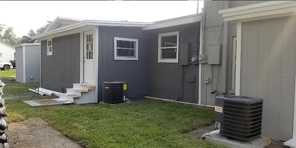 a backyard of a house with seating space