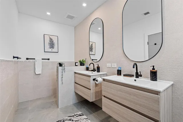 a bathroom with a sink and mirror