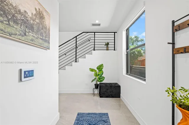 a potted plant sitting in front of a window