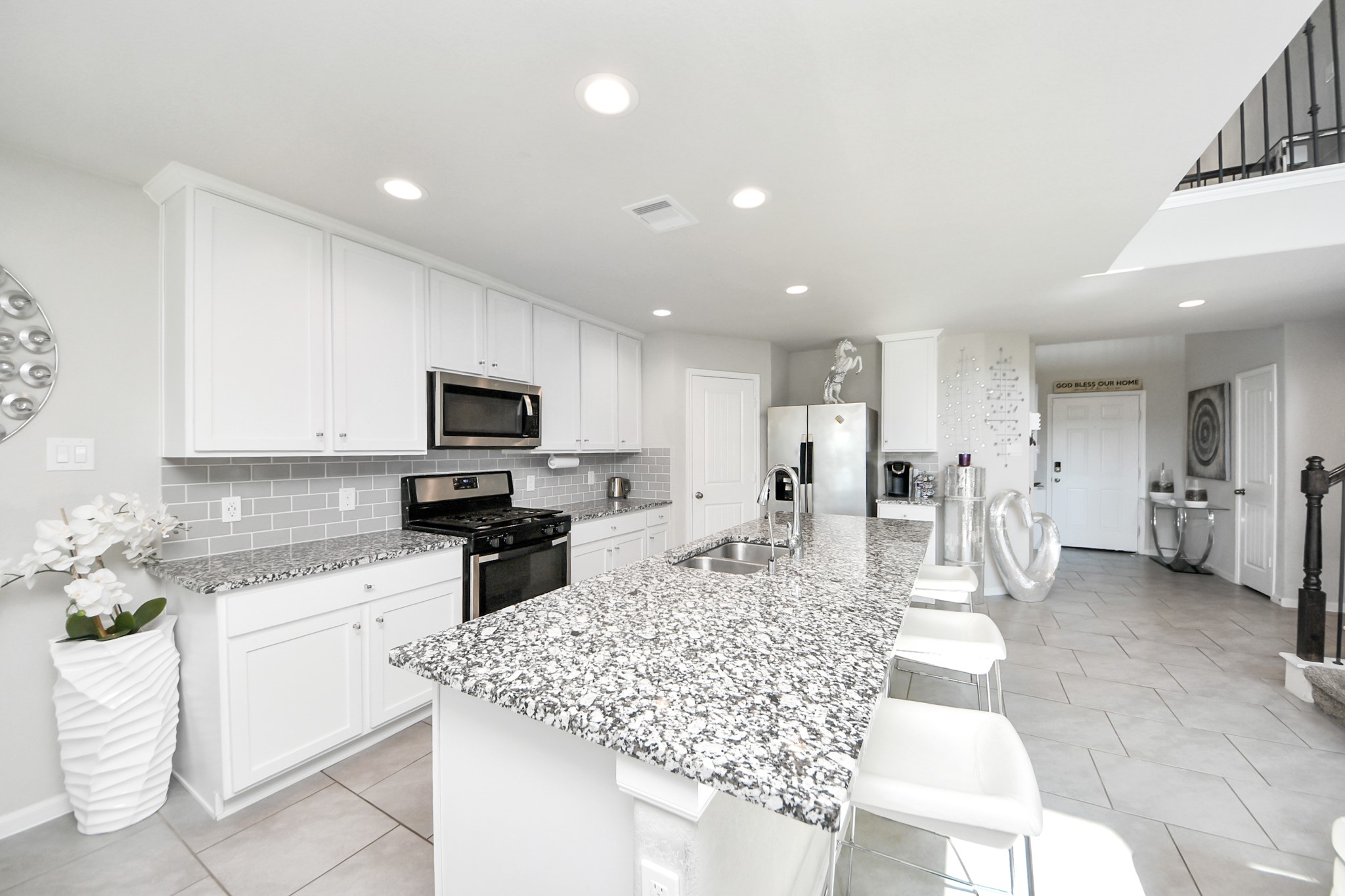 3514 Windham Way Katy, TX 77494 - Photo 26 of 42 a kitchen with stainless steel appliances kitchen island granite countertop a sink and cabinets