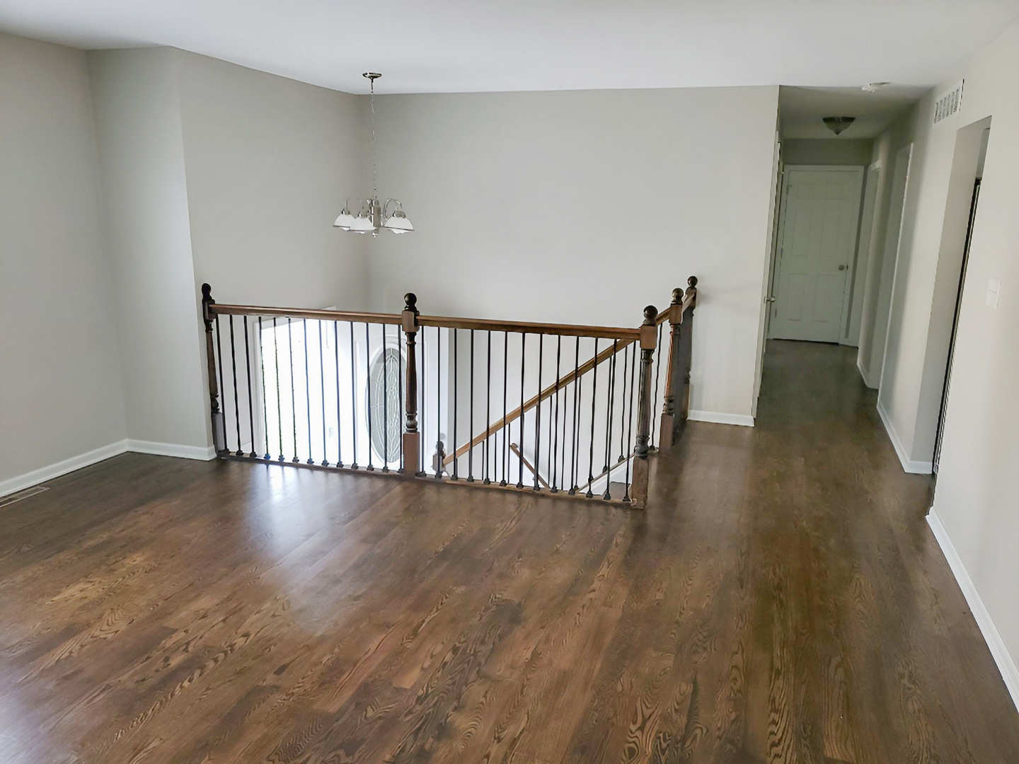 533 Surryse Road Lake Zurich, IL 60047 - Photo 11 of 51 a view of a hallway with wooden floor