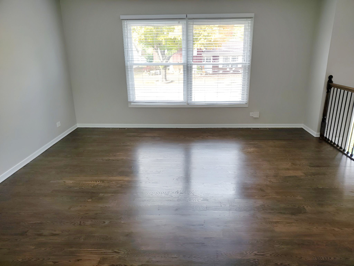 533 Surryse Road Lake Zurich, IL 60047 - Photo 12 of 51 an empty room with wooden floor and windows