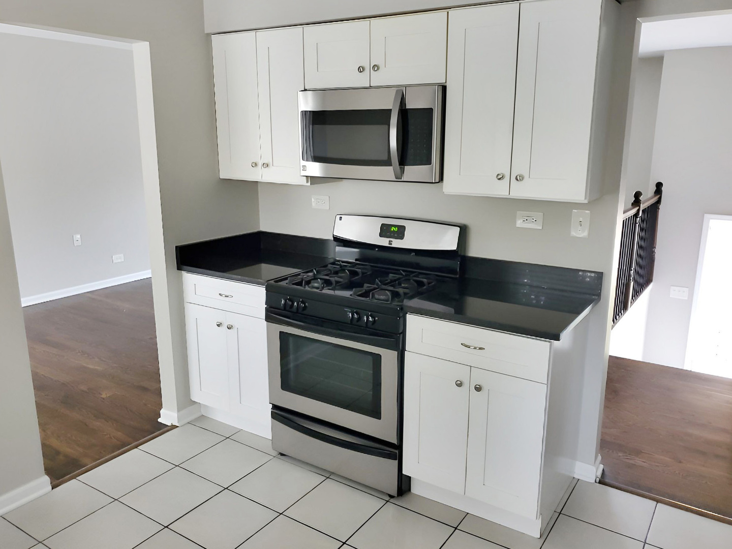 533 Surryse Road Lake Zurich, IL 60047 - Photo 16 of 51 a kitchen with granite countertop white cabinets and appliances