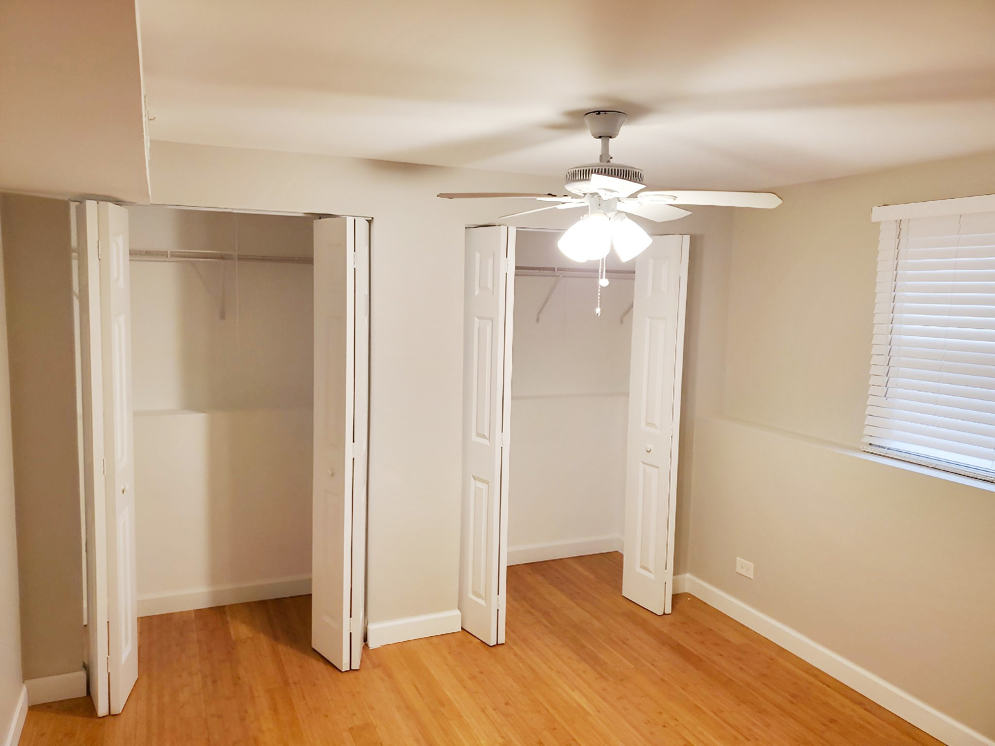 533 Surryse Road Lake Zurich, IL 60047 - Photo 37 of 51 wooden floor in an empty room with a window
