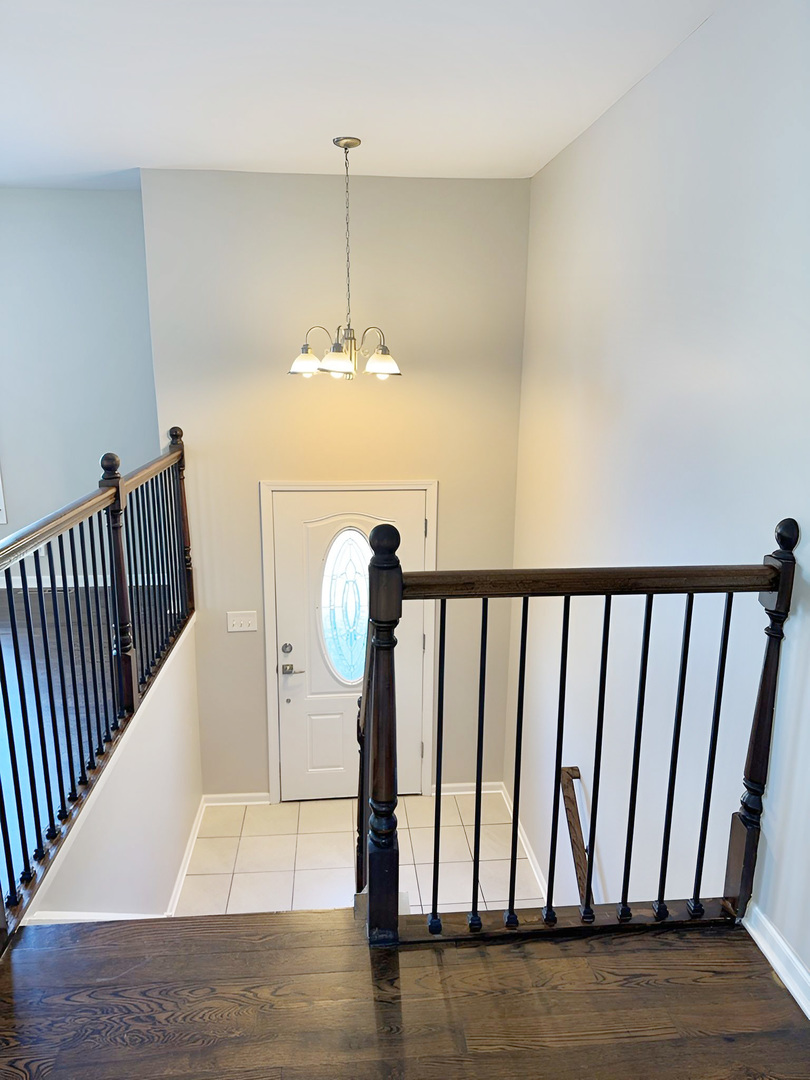 533 Surryse Road Lake Zurich, IL 60047 - Photo 9 of 51 a view of entryway and hall with wooden floor
