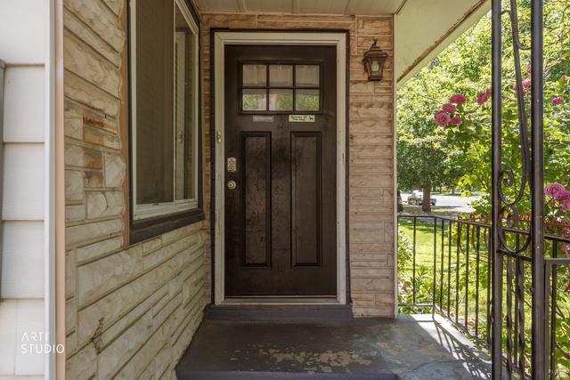 146 West 200 N Street Springville, UT 84663 - Photo 3 of 29 Entryway featuring a dark paneled door with glass inserts, stone facade, a side light window, and wrought iron railing