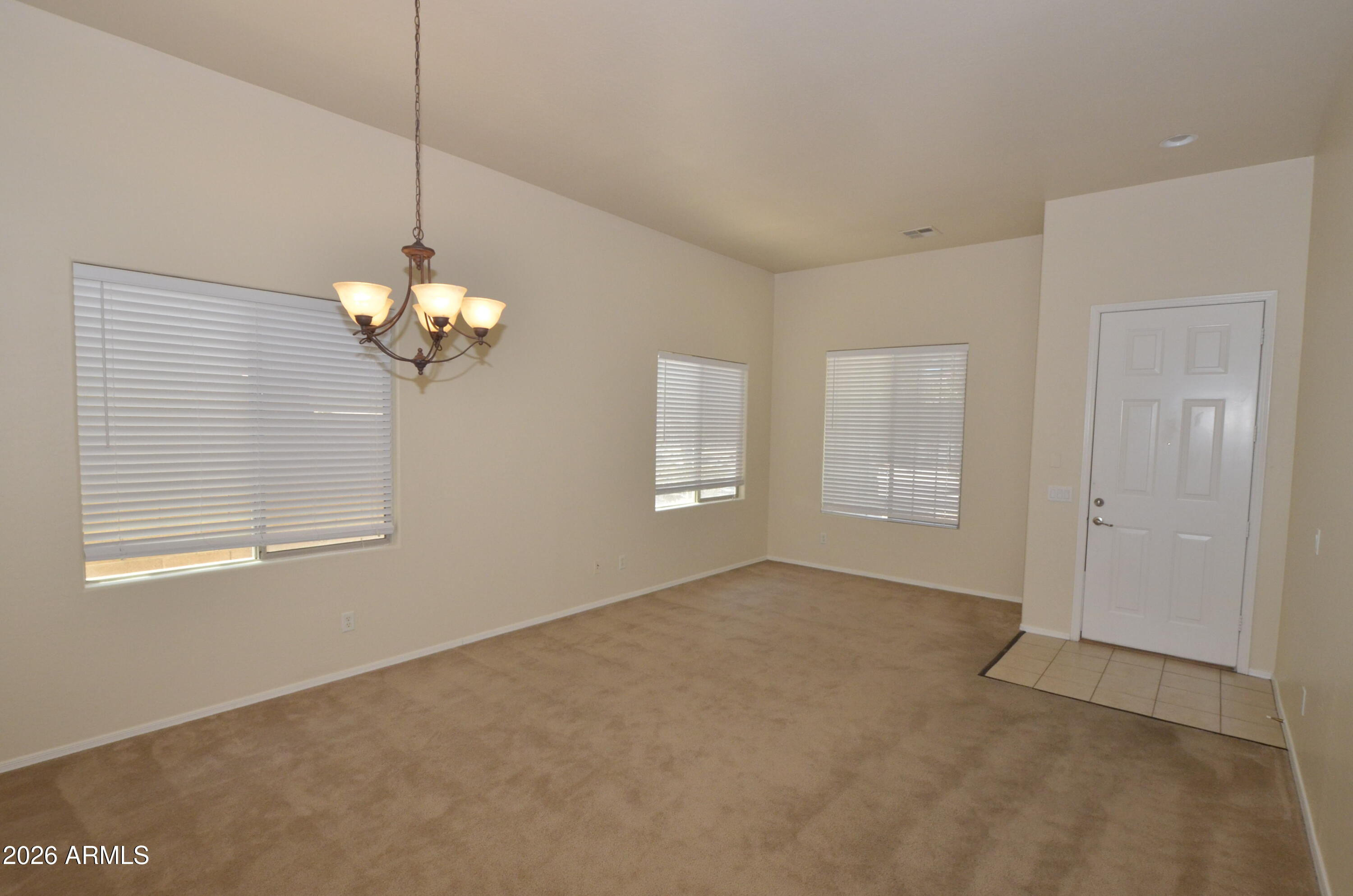3995 East Trigger Way Gilbert, AZ 85297 - Photo 3 of 23 a view of an empty room with a window