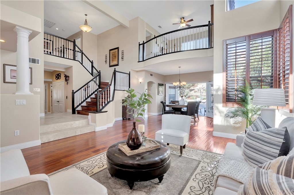 1600 Canyon Crest Circle Corona, CA 92882 - Photo 12 of 74 a living room with furniture and a potted plant