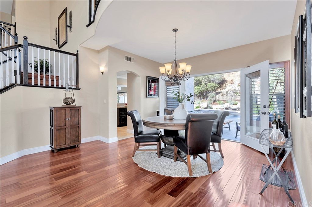 1600 Canyon Crest Circle Corona, CA 92882 - Photo 15 of 74 a view of a dining room with furniture window and wooden floor