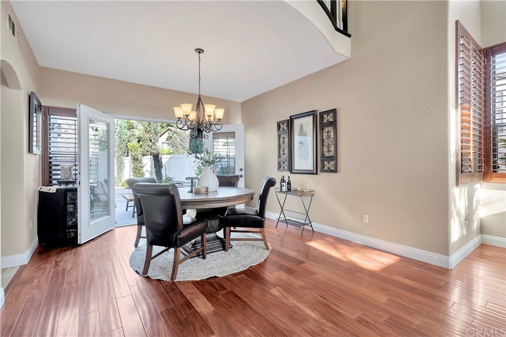 1600 Canyon Crest Circle Corona, CA 92882 - Photo 16 of 74 a view of a dining room with furniture window and wooden floor
