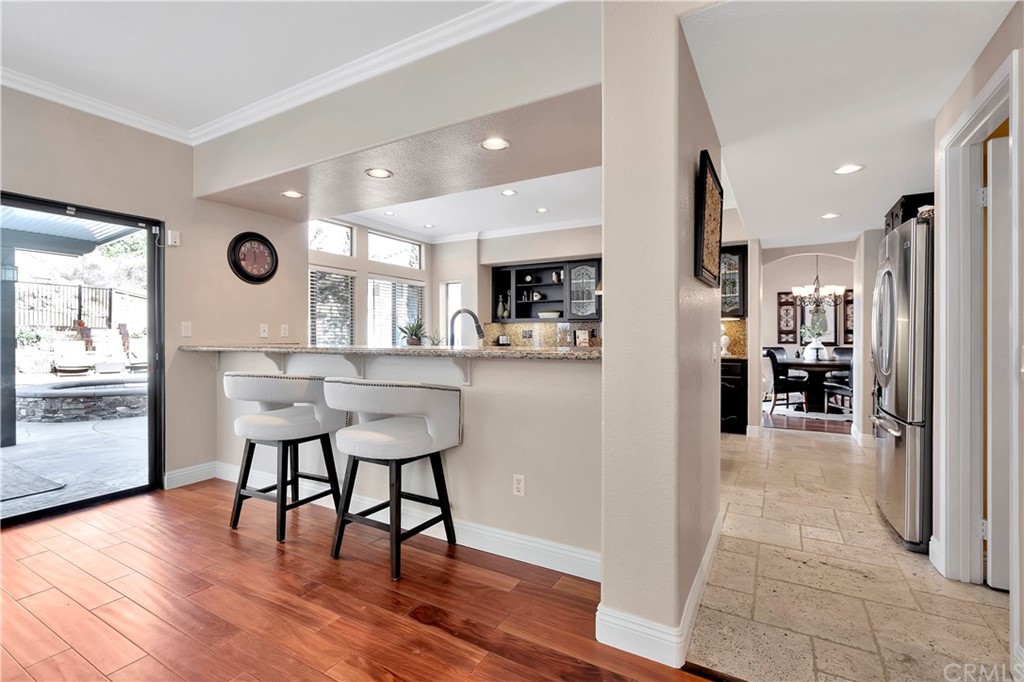 1600 Canyon Crest Circle Corona, CA 92882 - Photo 20 of 74 a view of a dining area with furniture and wooden floor