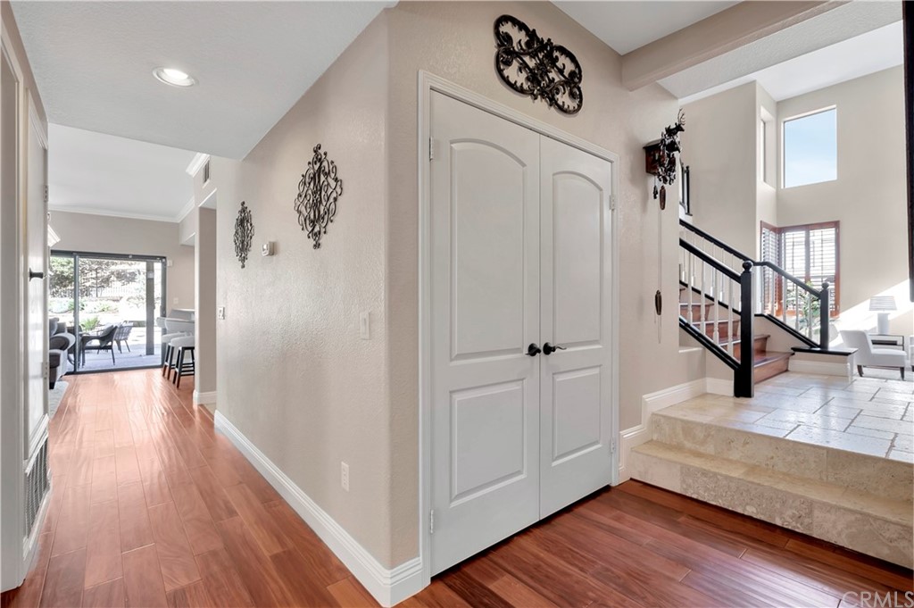 1600 Canyon Crest Circle Corona, CA 92882 - Photo 24 of 74 a view of a hallway with wooden floor and staircase