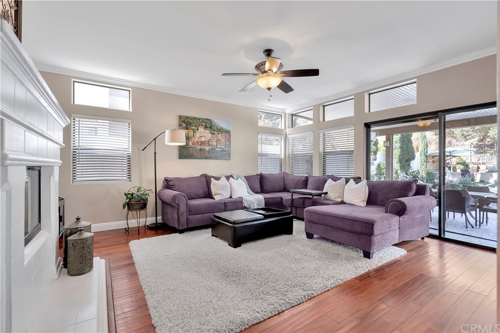 1600 Canyon Crest Circle Corona, CA 92882 - Photo 25 of 74 a living room with furniture large window and wooden floor