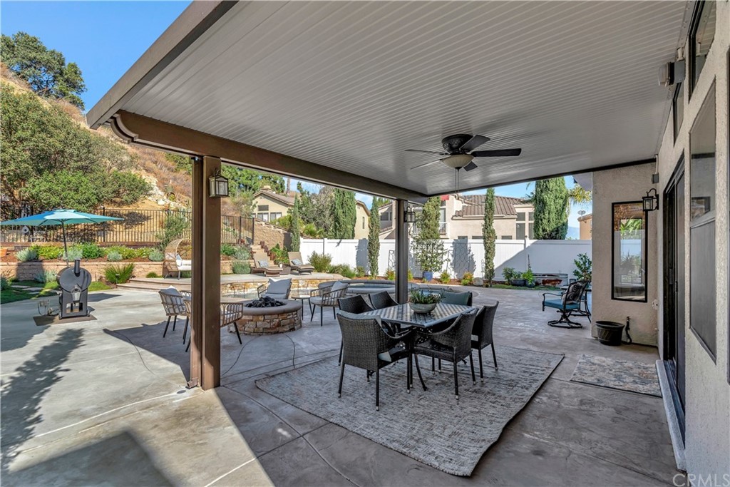 1600 Canyon Crest Circle Corona, CA 92882 - Photo 29 of 74 a living room with furniture and a large window
