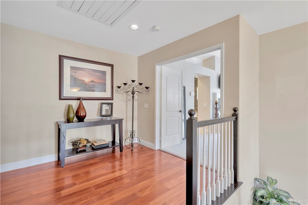1600 Canyon Crest Circle Corona, CA 92882 - Photo 38 of 74 a view of a hallway with wooden floor and furniture