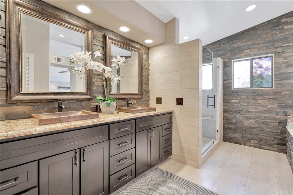 1600 Canyon Crest Circle Corona, CA 92882 - Photo 44 of 74 a bathroom with a granite countertop sink mirror and double