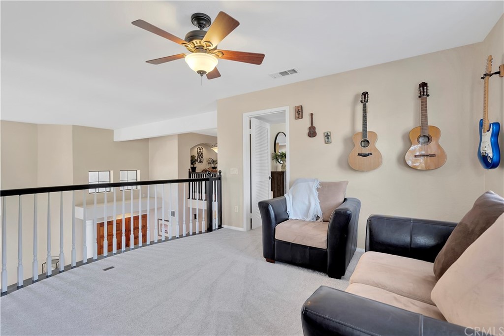 1600 Canyon Crest Circle Corona, CA 92882 - Photo 47 of 74 a living room with furniture and white walls