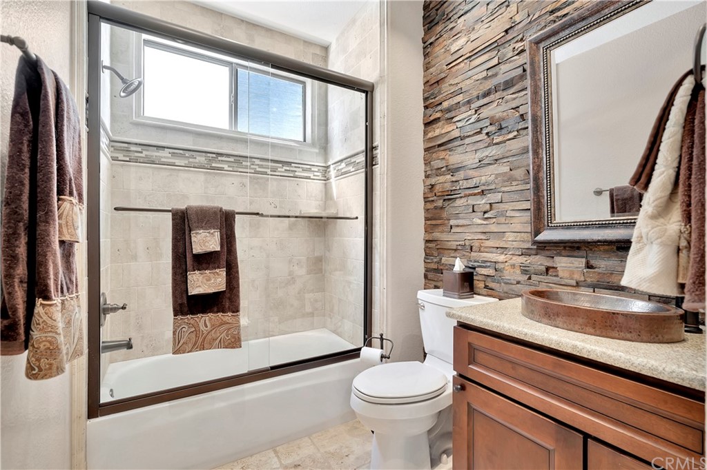 1600 Canyon Crest Circle Corona, CA 92882 - Photo 49 of 74 a bathroom with a sink a toilet and shower