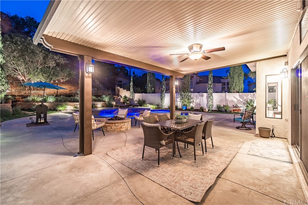 1600 Canyon Crest Circle Corona, CA 92882 - Photo 7 of 74 a view of a dining room with furniture chandelier and a rug