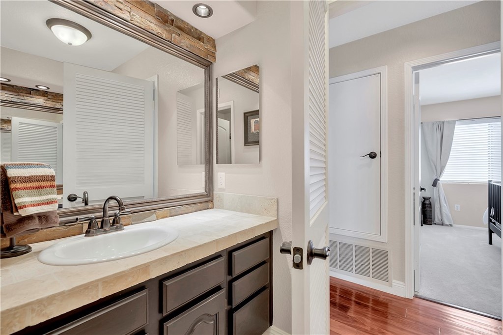 1600 Canyon Crest Circle Corona, CA 92882 - Photo 64 of 74 a bathroom with a sink and a mirror