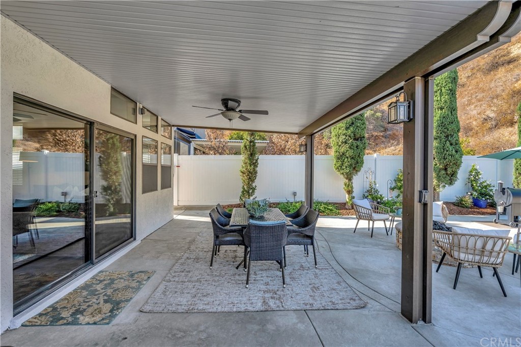 1600 Canyon Crest Circle Corona, CA 92882 - Photo 68 of 74 a view of a dining room with furniture wooden floor and floor to ceiling windows