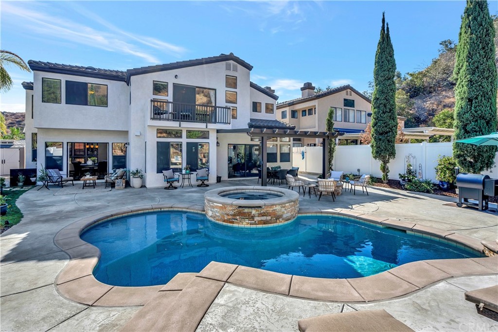 1600 Canyon Crest Circle Corona, CA 92882 - Photo 69 of 74 a swimming pool with outdoor seating and yard