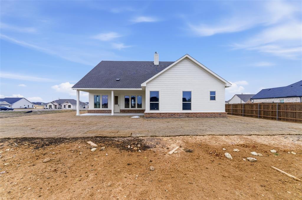 114 Brandywine Trail Rhome, TX 76078 - Photo 25 of 27 a view of a house with a yard