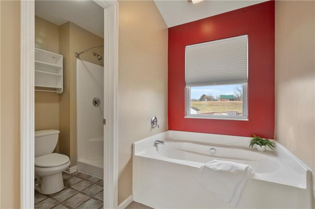 208 Commodore Drive McDonald, PA 15057 - Photo 19 of 36 a bathroom with a toilet sink and mirror