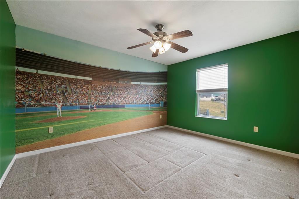 208 Commodore Drive McDonald, PA 15057 - Photo 23 of 36 a view of a room with window a ceiling fan and a kitchen view