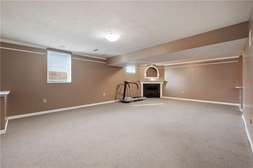 208 Commodore Drive McDonald, PA 15057 - Photo 25 of 36 a view of empty room with fireplace