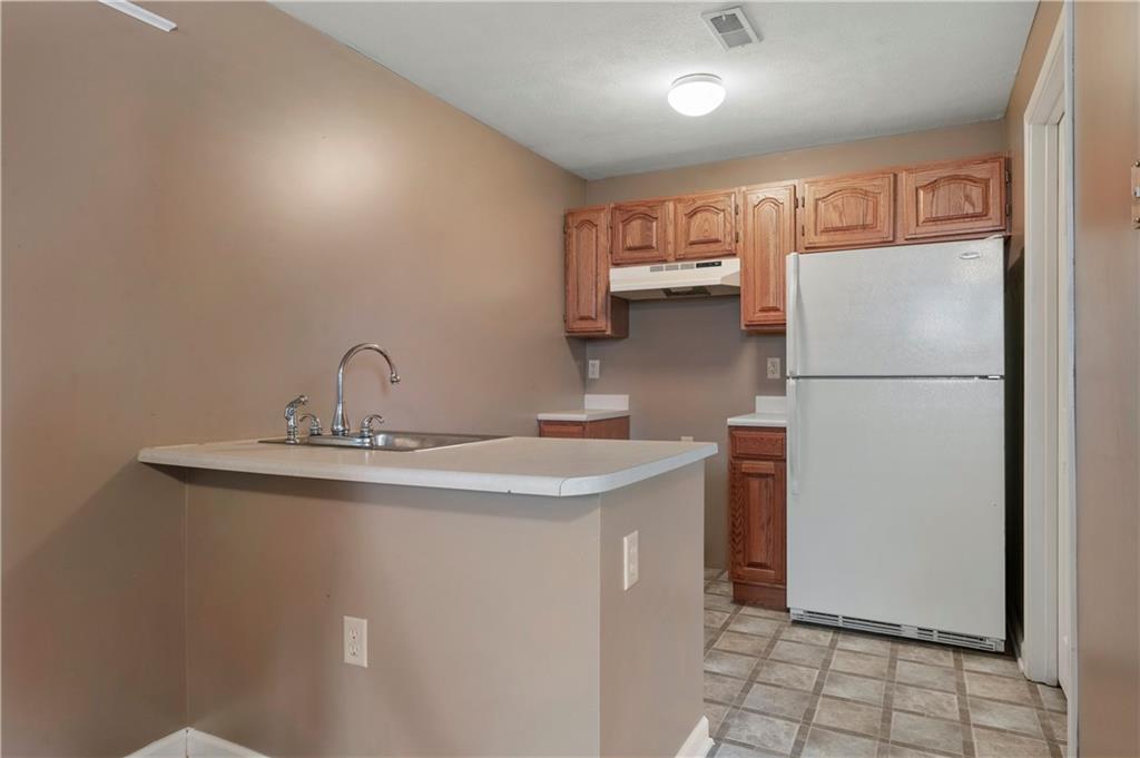208 Commodore Drive McDonald, PA 15057 - Photo 27 of 36 a kitchen with stainless steel appliances a refrigerator and a sink