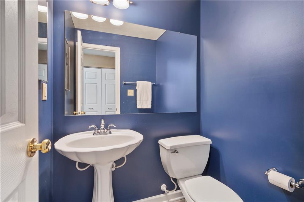 208 Commodore Drive McDonald, PA 15057 - Photo 28 of 36 a bathroom with a toilet sink and mirror