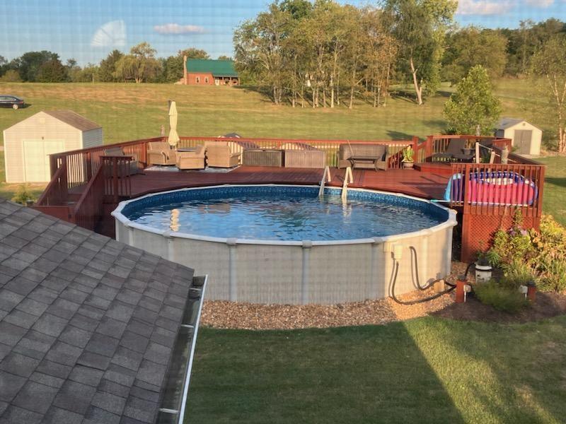 208 Commodore Drive McDonald, PA 15057 - Photo 31 of 36 a view of a swimming pool with a lake view