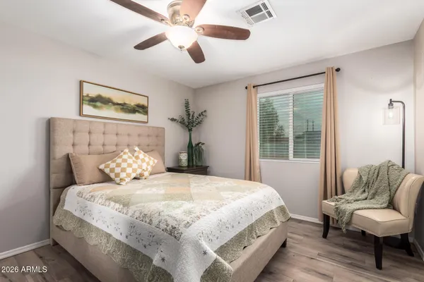 a bedroom with a bed and a couch