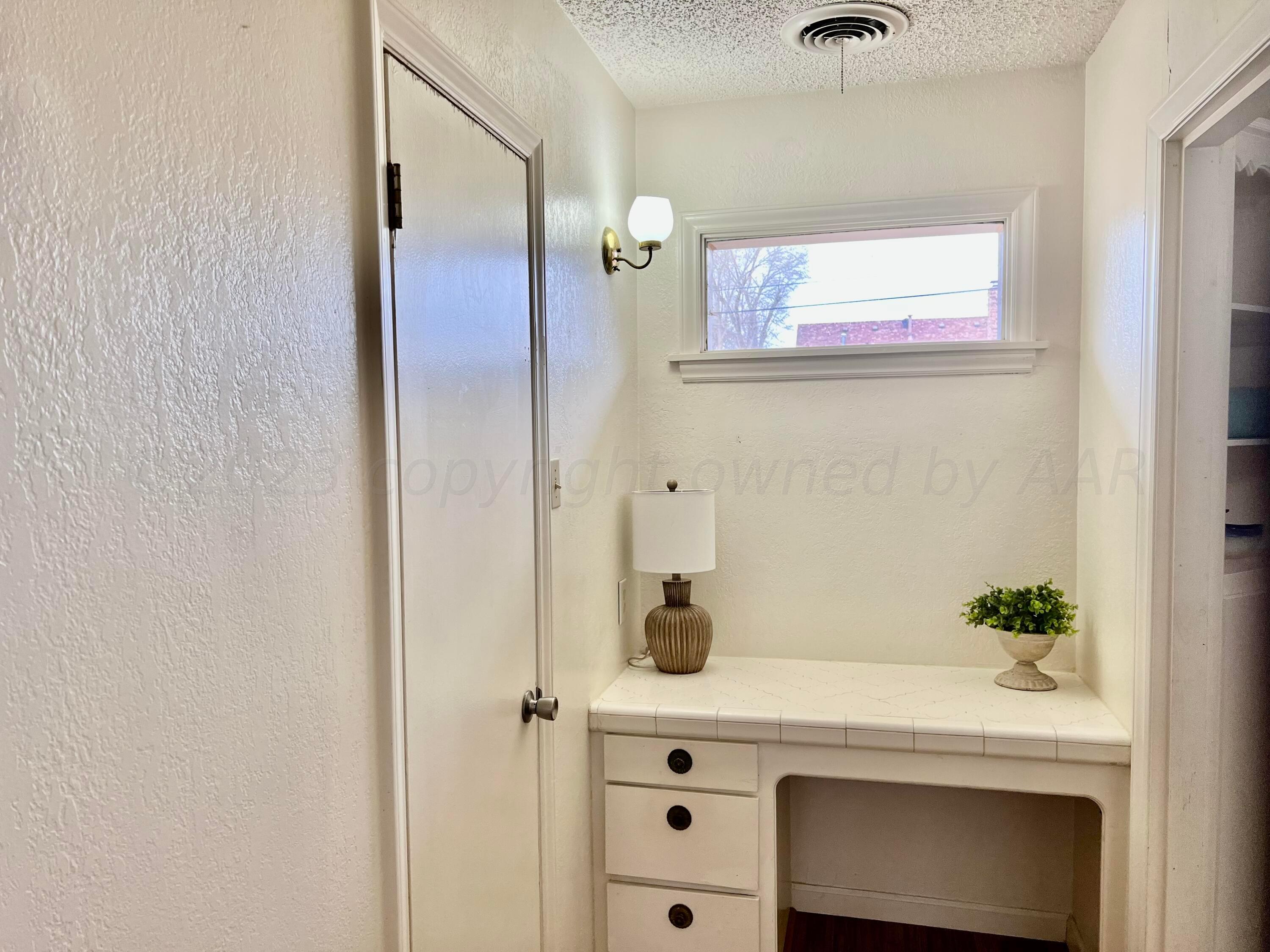 4600 Southwest 38th Avenue Amarillo, TX 79109 - Photo 12 of 19 a bathroom with a sink and a mirror