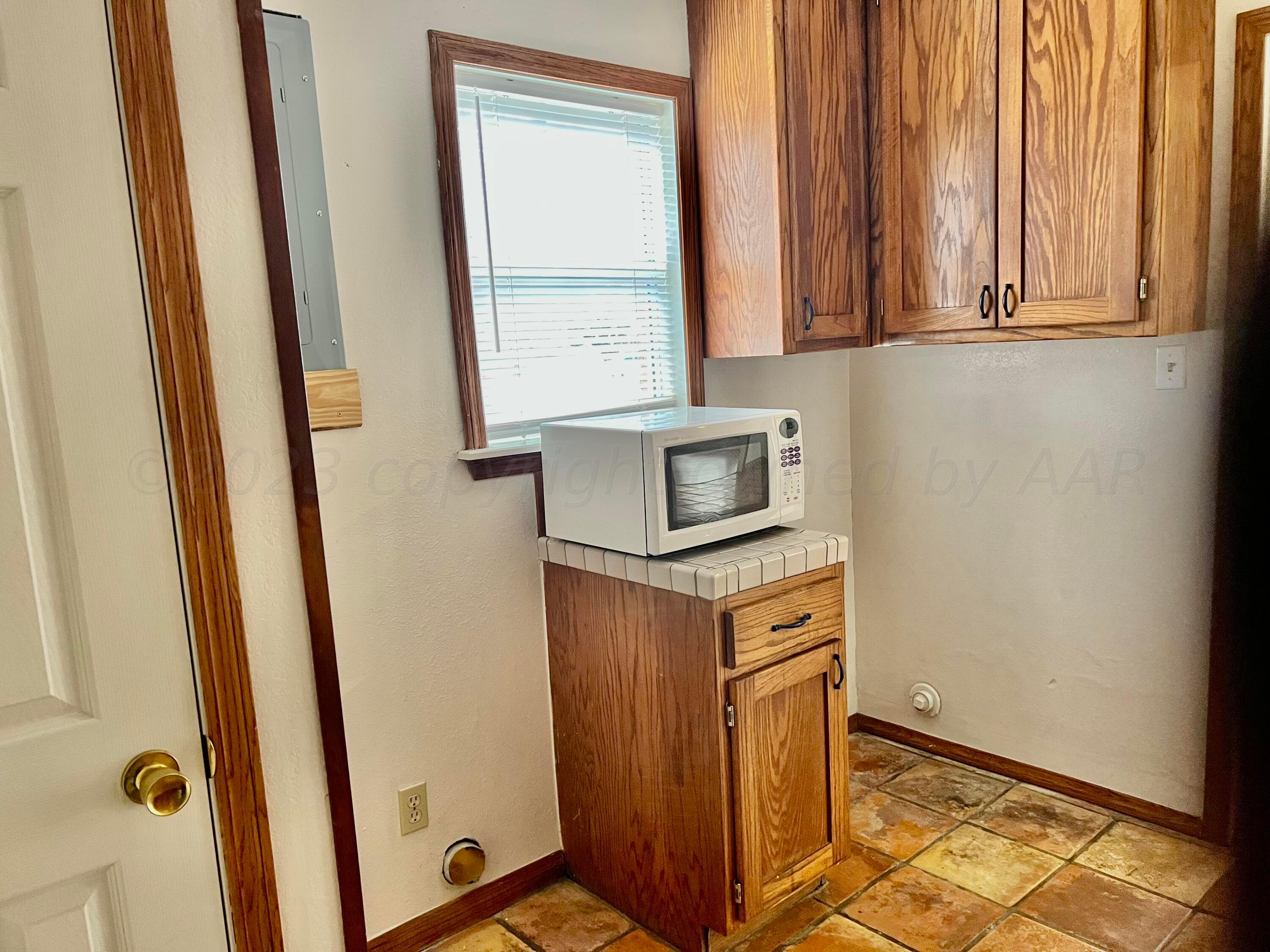 4600 Southwest 38th Avenue Amarillo, TX 79109 - Photo 7 of 19 a kitchen with stainless steel appliances granite countertop cabinets and a granite counter tops